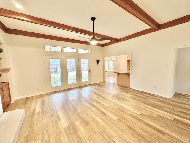 unfurnished living room featuring ceiling fan, beam ceiling, and light hardwood / wood-style floors