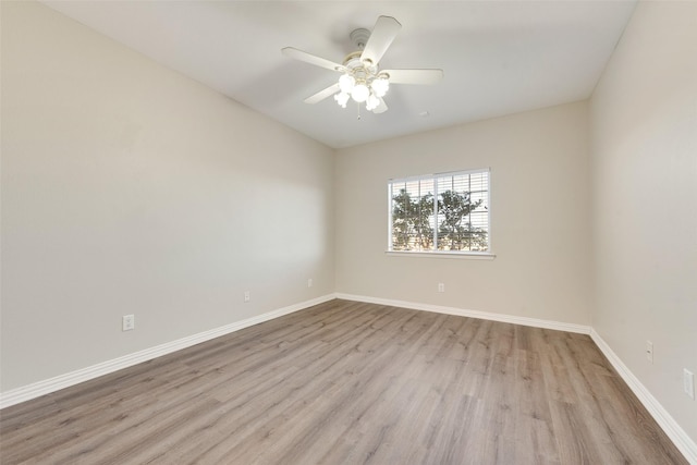 empty room featuring ceiling fan and light wood-type flooring