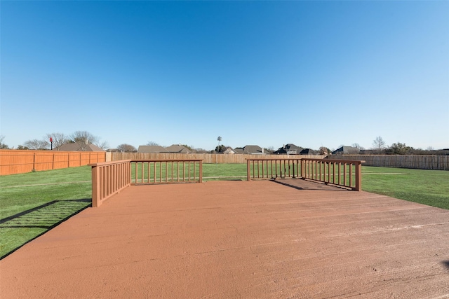 wooden deck with a lawn