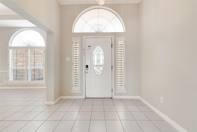 entrance foyer featuring light tile patterned flooring and plenty of natural light