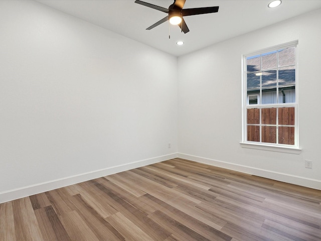 unfurnished room featuring ceiling fan and light hardwood / wood-style flooring