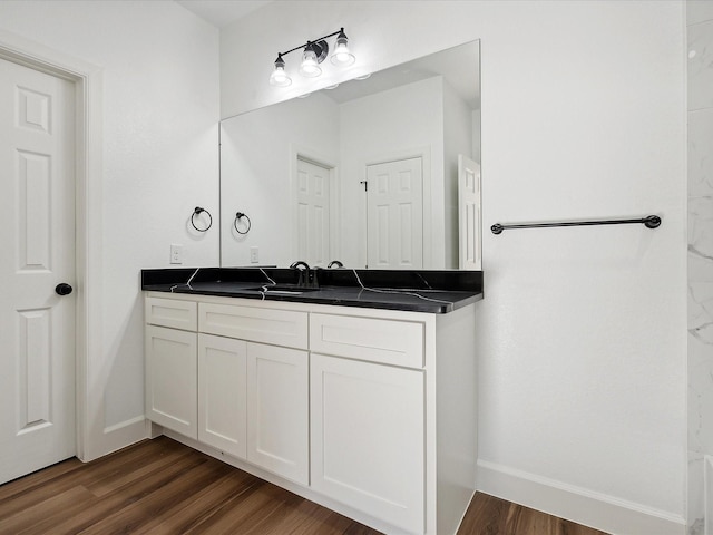 bathroom with wood-type flooring and vanity