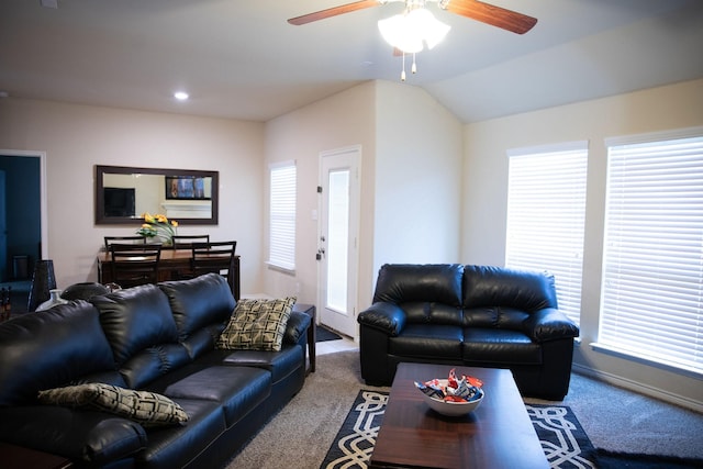 living room with lofted ceiling, carpet floors, ceiling fan, and plenty of natural light