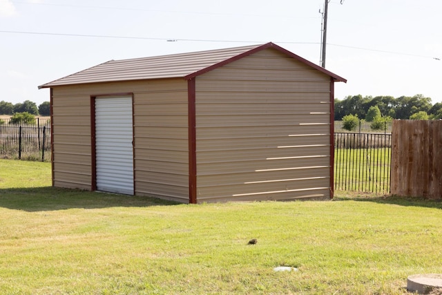 view of outdoor structure with a lawn