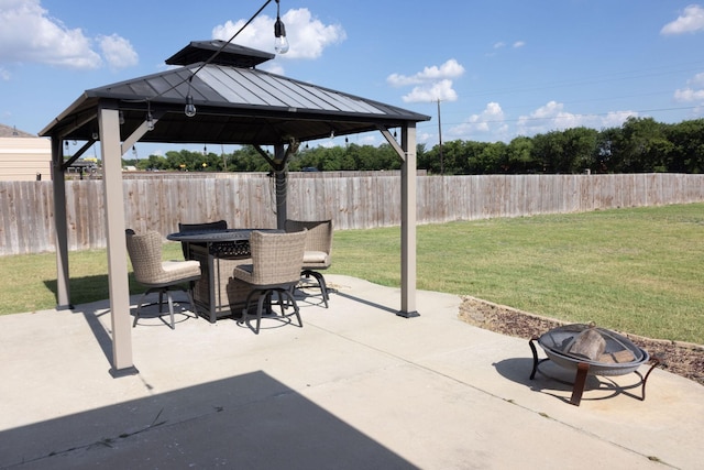 view of patio featuring a gazebo and an outdoor fire pit