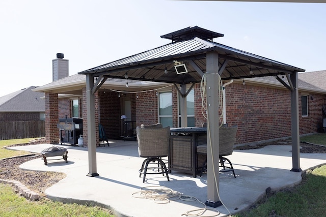 view of patio / terrace with a gazebo and a grill