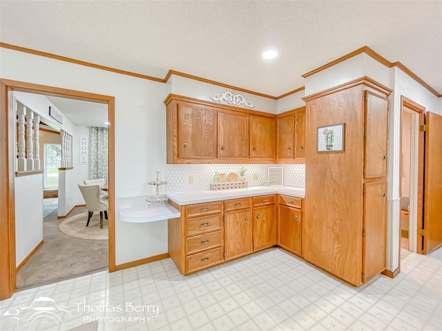 kitchen featuring light carpet, decorative backsplash, and ornamental molding