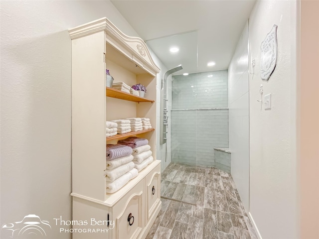 bathroom with tiled shower