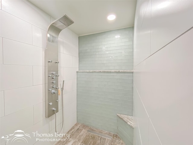 bathroom with tiled shower