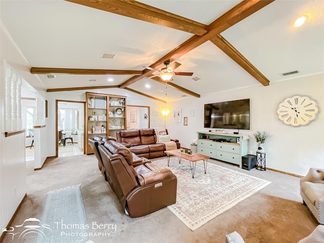 living room with ceiling fan, lofted ceiling with beams, and light carpet