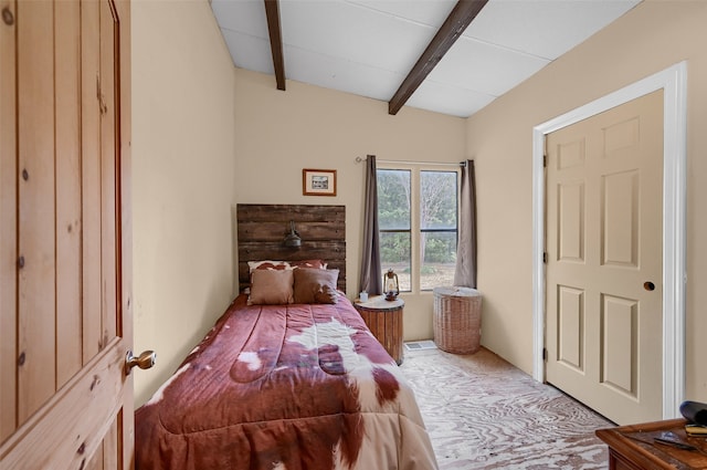 bedroom with beam ceiling