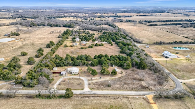 birds eye view of property featuring a rural view