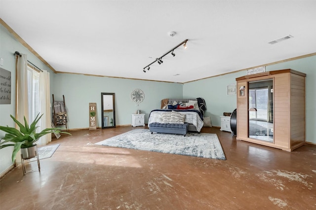 bedroom with track lighting and ornamental molding