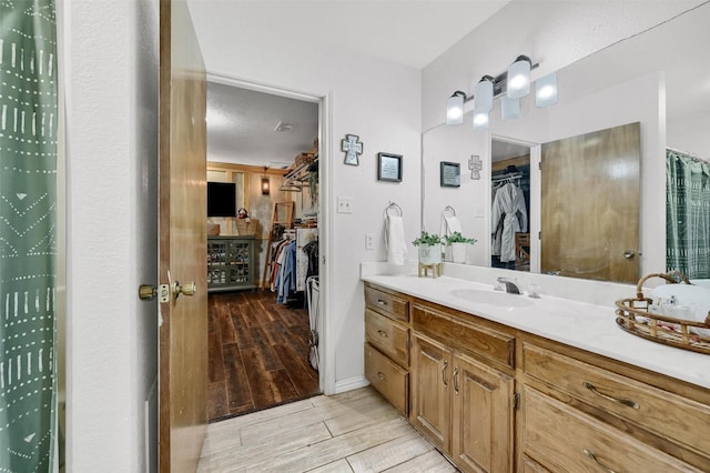 bathroom with vanity and a textured ceiling