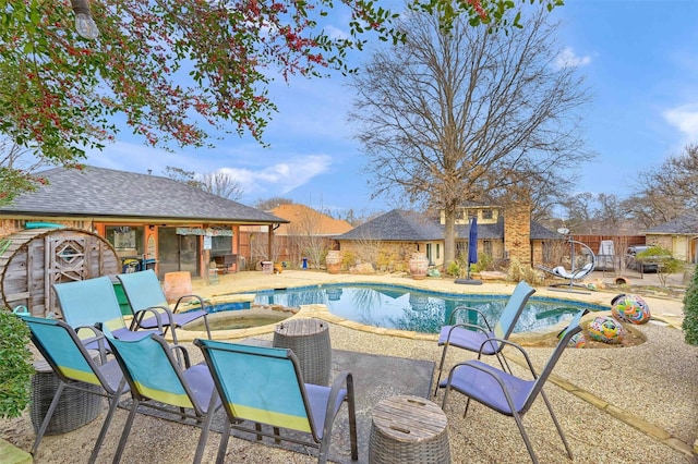 view of pool featuring a hot tub and a patio