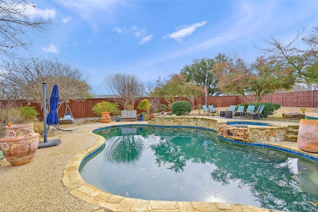 view of swimming pool featuring a patio area