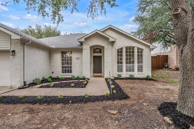 ranch-style home featuring a garage