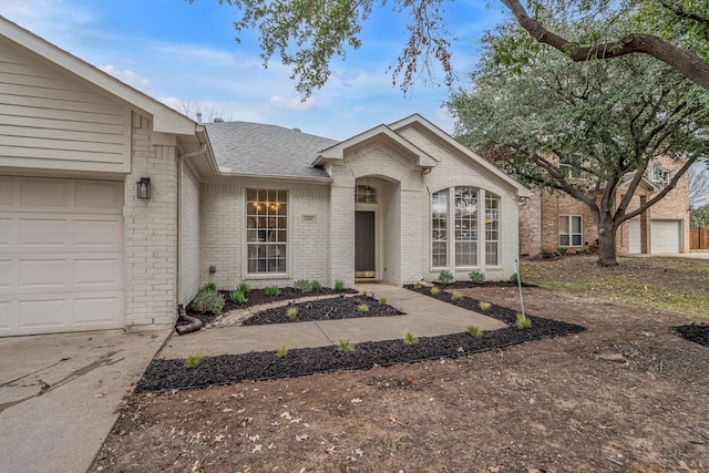 ranch-style house featuring a garage