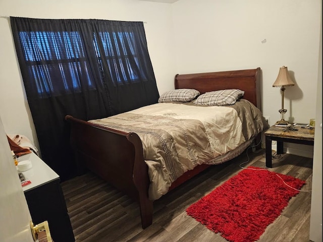 bedroom featuring wood finished floors