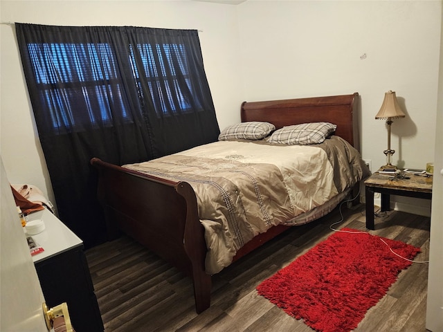 bedroom featuring wood finished floors
