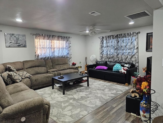 living room featuring wood finished floors, a ceiling fan, and recessed lighting
