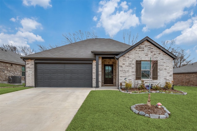 view of front facade featuring a front yard, brick siding, a garage, and driveway