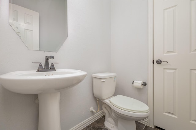 bathroom featuring tile patterned flooring, sink, and toilet