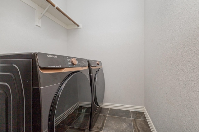 laundry area featuring washing machine and clothes dryer