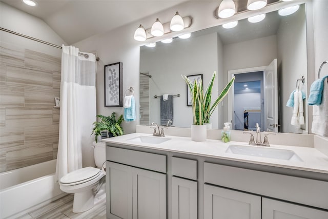 full bathroom with vanity, lofted ceiling, shower / bathtub combination with curtain, and toilet