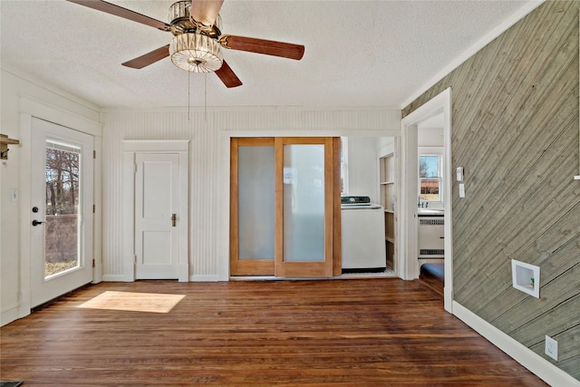 interior space featuring washer / clothes dryer and ceiling fan