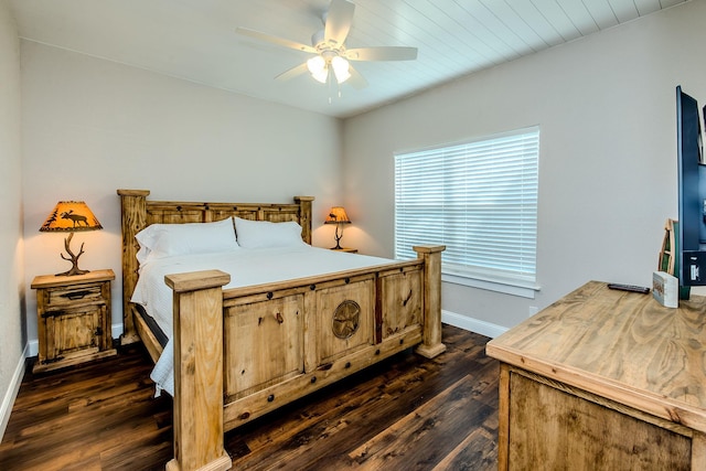 bedroom featuring dark hardwood / wood-style flooring and ceiling fan