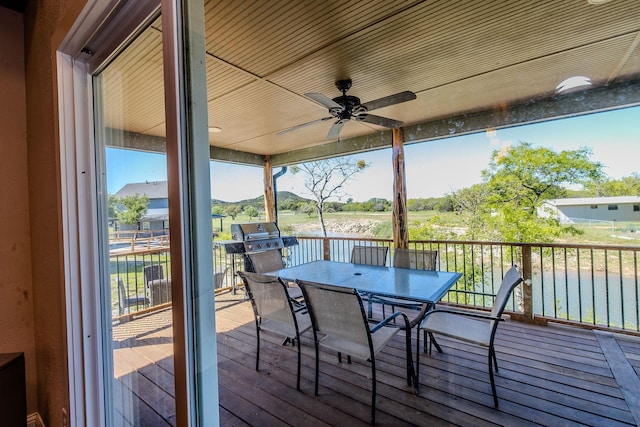 exterior space featuring a mountain view and ceiling fan