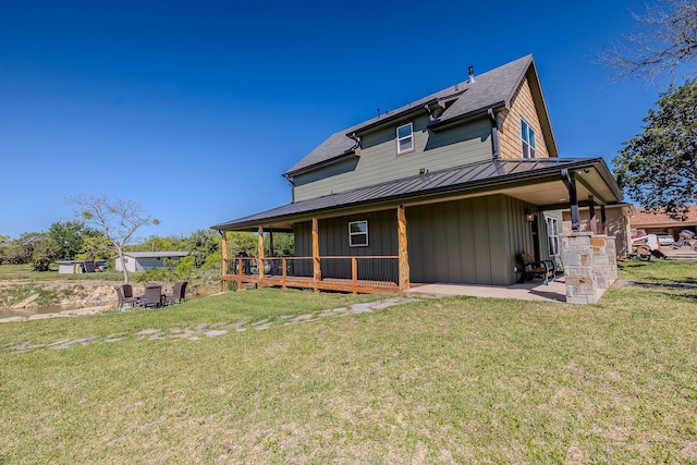 exterior space featuring a lawn and a patio area