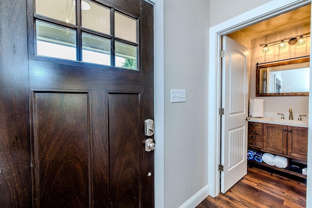 entryway featuring sink and dark hardwood / wood-style floors