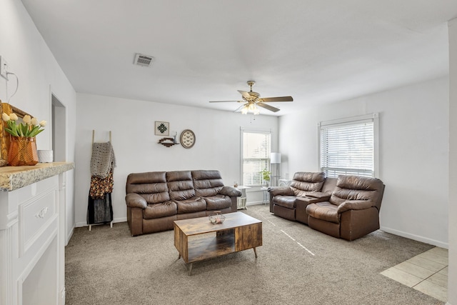 living room featuring carpet floors and ceiling fan