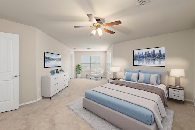 bedroom with a ceiling fan, visible vents, light carpet, and baseboards