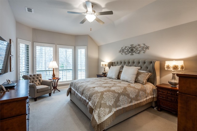 carpeted bedroom with vaulted ceiling and ceiling fan