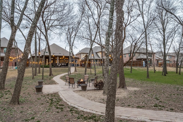 view of community featuring a fire pit