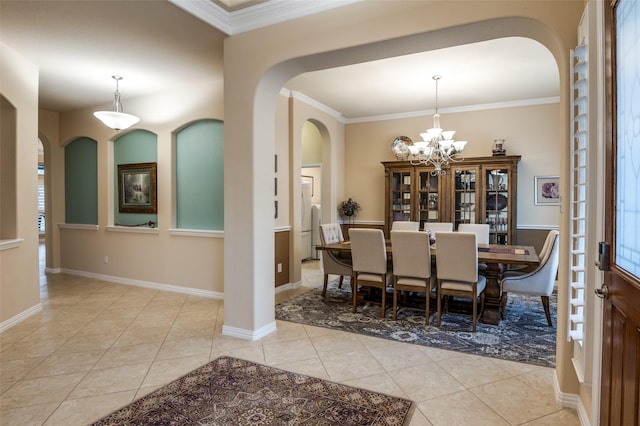 tiled dining room featuring crown molding and a chandelier