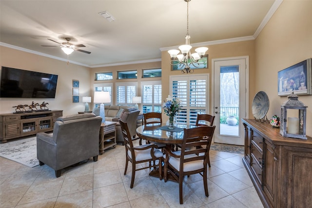 tiled dining area with ceiling fan with notable chandelier and ornamental molding