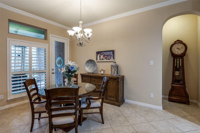 tiled dining room with ornamental molding and a notable chandelier