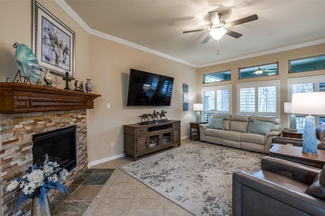 living room featuring tile patterned flooring, crown molding, ceiling fan, and a fireplace