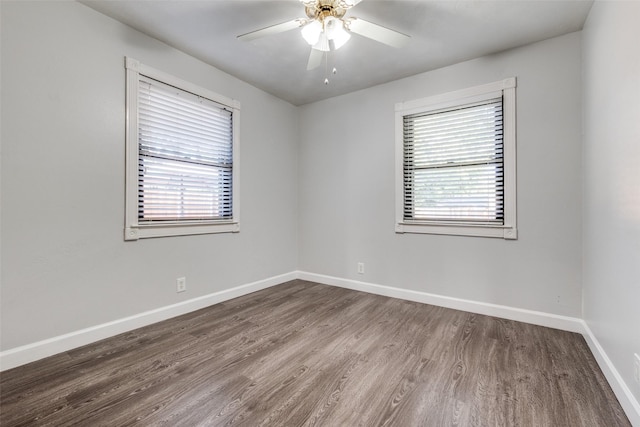 spare room featuring hardwood / wood-style flooring and ceiling fan