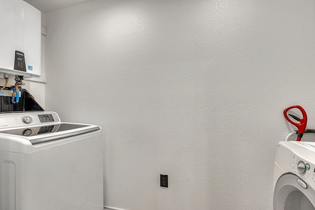 laundry room featuring water heater