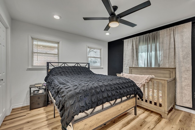 bedroom featuring light hardwood / wood-style floors and ceiling fan