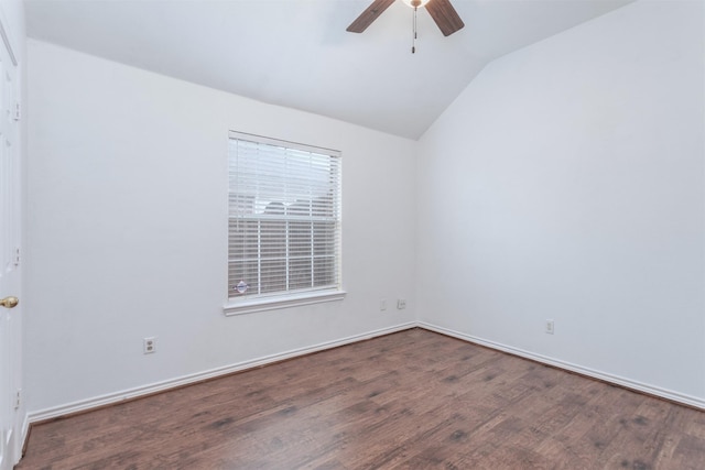 empty room featuring hardwood / wood-style flooring, ceiling fan, and vaulted ceiling