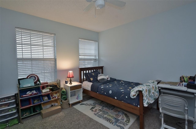 bedroom with ceiling fan and carpet