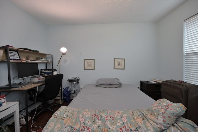 bedroom featuring dark wood-type flooring