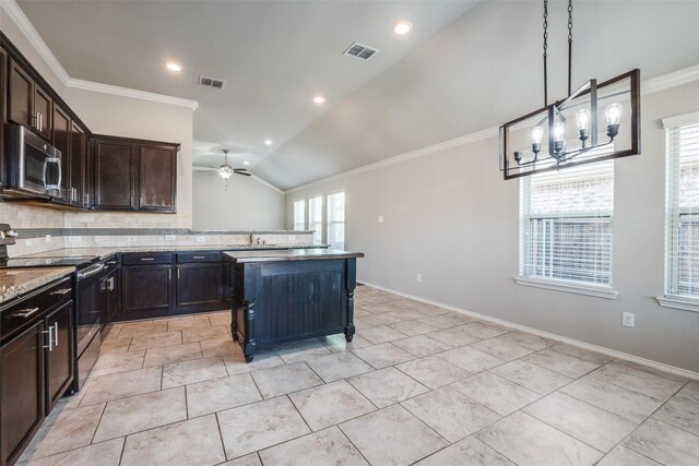 kitchen with sink, crown molding, a center island, appliances with stainless steel finishes, and backsplash