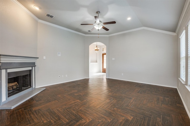 unfurnished living room with ceiling fan, ornamental molding, and dark parquet flooring